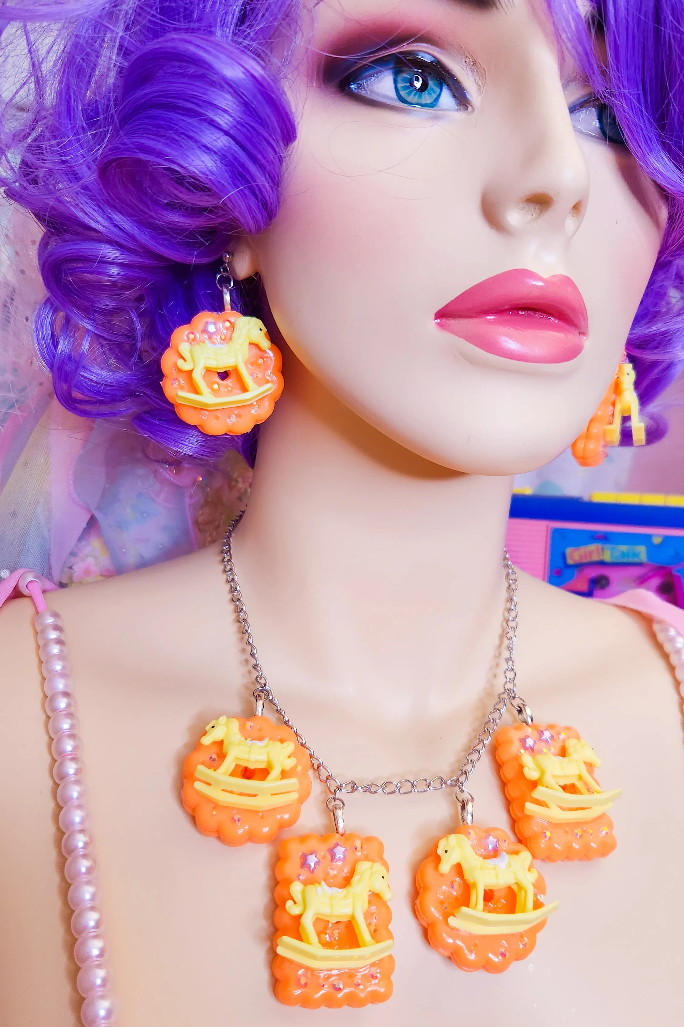 Orange cracker biscuit rocking horse charm necklace