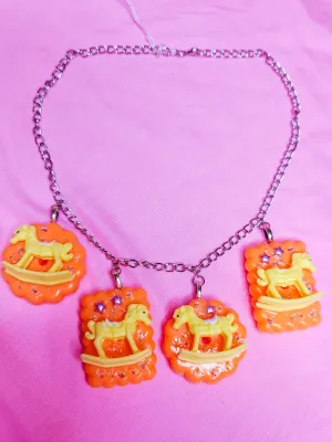 Orange cracker biscuit rocking horse charm necklace